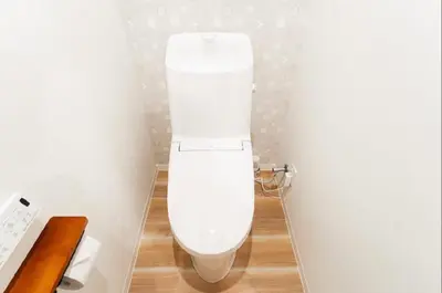 a bathroom with a white toilet in a room at SAIE Sakura hotel in Tokyo