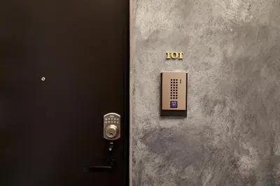 a door with a control panel on the side of a wall at Tokyo Sky Suite Hotel in Tokyo