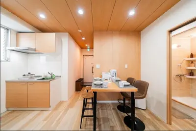 a kitchen with a table with cups and dishes on it at SAIE Skyview hotel in Tokyo