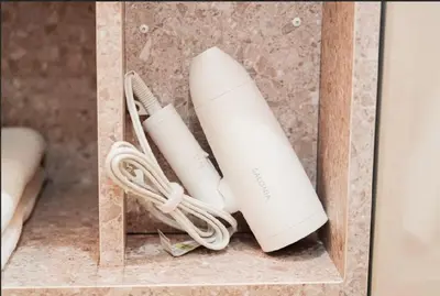 two white wii controllers in a wooden box at SAIE Skyview hotel in Tokyo