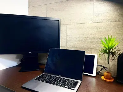 a laptop computer and a monitor on a desk at Yoi-Machi Heiwajima in Tokyo