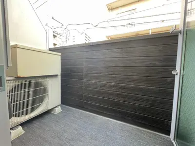 a garage with a wooden garage door in a room at Yoi-Machi Heiwajima in Tokyo