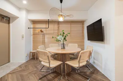 a dining room with a table and chairs at Second Home SHINJUKU in Tokyo