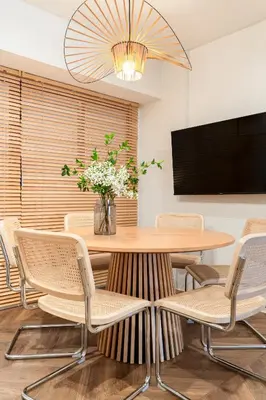 a dining room with a table and chairs at Second Home SHINJUKU in Tokyo
