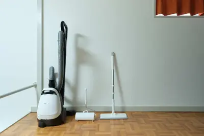 a room with two vacuum cleaners on a wooden floor at Sakura Yoyogi by Tranova by Tranova in Tokyo