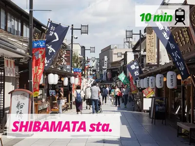 a busy city street with people walking down a street at LAGOON Suite OHANA in Tokyo