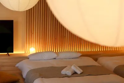 a hotel room with two beds with towels on them at \u30b5\u30f3\u30e2\u30fc\u30eb\u30af\u30ec\u30b9\u30c8506 in Tokyo