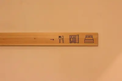 a wooden shelf on a wall with a sign on it at \u30b5\u30f3\u30e2\u30fc\u30eb\u30af\u30ec\u30b9\u30c8506 in Tokyo