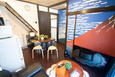 a living room with a table and a tv at Omori Tei\u5927\u68ee\u4eadOMT 18min to Haneda, 3min Omori, Max 7 people in Tokyo