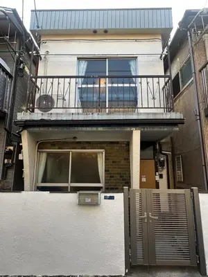a house with a balcony and a gate in front of it at Omori Tei\u5927\u68ee\u4eadOMT 18min to Haneda, 3min Omori, Max 7 people in Tokyo