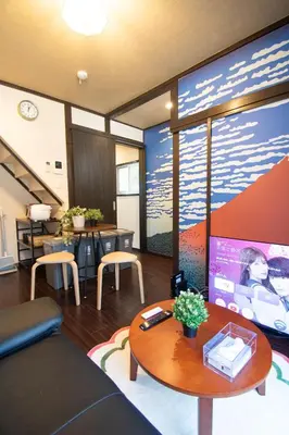 a living room with a tv and a table at Omori Tei\u5927\u68ee\u4eadOMT 18min to Haneda, 3min Omori, Max 7 people in Tokyo