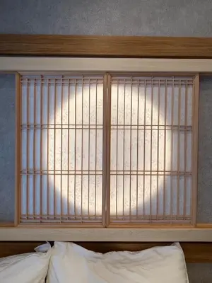 a headboard of a bed with a barred window at fukuhana \u6771\u65b0\u5bbf C3 in Tokyo
