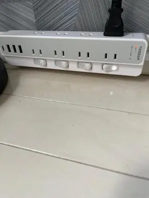 a white phone sitting on top of a table at Park side stay Shinjuku in Tokyo