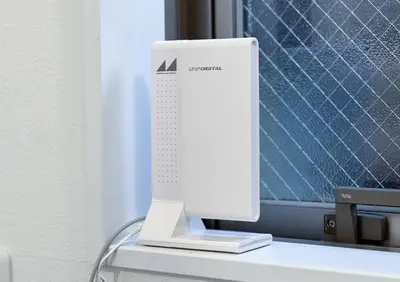 a white computer monitor sitting on top of a desk at \u6c60\u888b3\u4e01\u76ee\u6238\u5efa in Tokyo