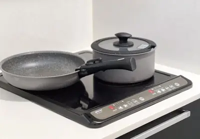 a pot on a stove with a pan on it at \u6c60\u888b3\u4e01\u76ee\u6238\u5efa in Tokyo