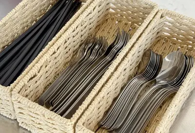 three forks and spoons in a wicker basket at \u30a8\u30b9\u30dd\u30ef\u30fc\u30eb10f in Tokyo