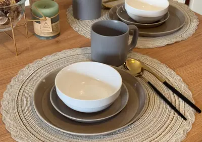 a table with three plates and a cup and aucer at \u65e7U\u90b82f3f in Tokyo