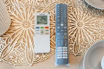 a remote control sitting next to a remote controlimeter at Shinjuku SAIEI Hotel 301 in Tokyo