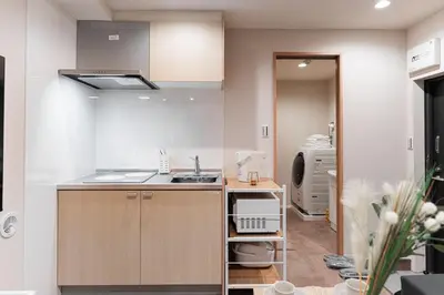 a kitchen with a sink and a counter top at Shinjuku SAIEI Hotel 301 in Tokyo