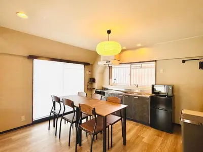 a kitchen with a table and chairs in a room at #601 Tokyo Ryogoku Hokusai Katsushika in Tokyo