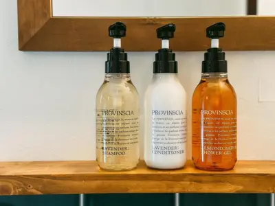 a group of four bottles sitting on a shelf at B-C APARTMENT Asakusa Hanazono Dori - Vacation STAY 92836v in Tokyo