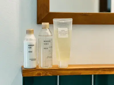 a shelf with two bottles of detergent and a bottle of milk at B-C APARTMENT Asakusa Hanazono Dori - Vacation STAY 92836v in Tokyo
