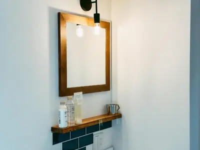 a bathroom with a mirror and a sink at B-C APARTMENT Asakusa Hanazono Dori - Vacation STAY 92836v in Tokyo