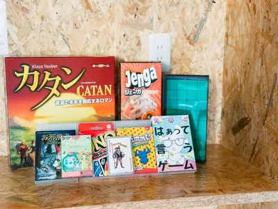 a pile of books sitting on top of a table at B-C APARTMENT Asakusa Hanazono Dori - Vacation STAY 92836v in Tokyo
