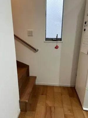 an empty room with a staircase and a window at Yoyogi Premier 4BR House in Tokyo