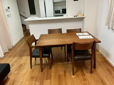 a dining room table and chairs in a room at Yoyogi Premier 4BR House in Tokyo