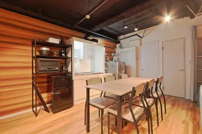 a kitchen and dining room with a table and chairs at Steps from Shibuya Crossing B in Tokyo