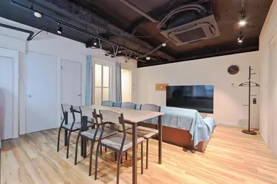a dining room with a table and chairs at Steps from Shibuya Crossing B in Tokyo