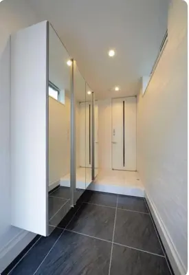 an empty room with a hallway with glass doors at \u795e\u5bae\u524d2\u4e01\u76ee in Tokyo