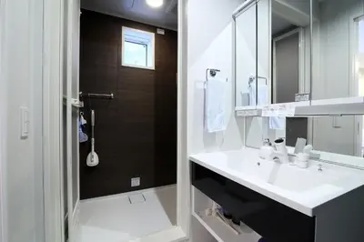 a bathroom with a sink and a shower at \u795e\u5bae\u524d2\u4e01\u76ee in Tokyo