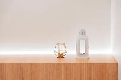 a lantern and a bottle on a wooden table at Shinjuku SAIEI Horizon Hotel in Tokyo
