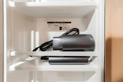 a briefcase sitting on a shelf in a refrigerator at Shinjuku SAIEI Horizon Hotel in Tokyo