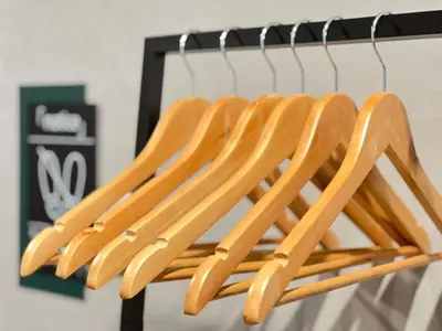a bunch of wooden utensils hanging on a rack at nestay villa tokyo nippori in Tokyo