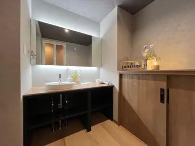 a bathroom with a sink and a mirror at nestay villa tokyo nippori in Tokyo