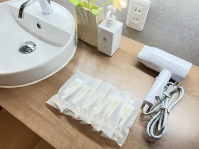 a bathroom counter with a sink and a towel at nestay villa tokyo nippori in Tokyo