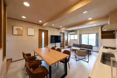 a kitchen and living room with a table and chairs at Direct to Skytree Asakusa 6min Walk to Station A162 in Tokyo