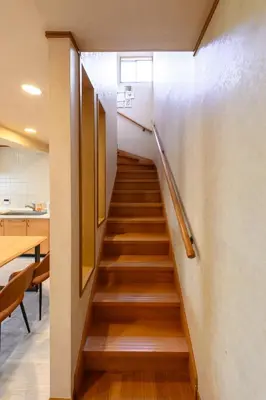 a staircase in a room with a table and chairs at Direct to Skytree Asakusa 6min Walk to Station A162 in Tokyo