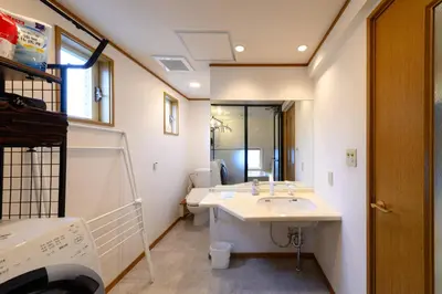 a bathroom with a sink and a mirror at Direct to Skytree Asakusa 6min Walk to Station A162 in Tokyo