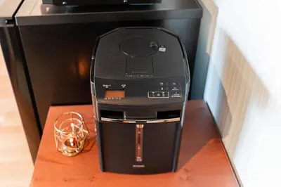 a black printer sitting on top of a wooden table at Shinjuku SAIEI Hotel 201 in Tokyo