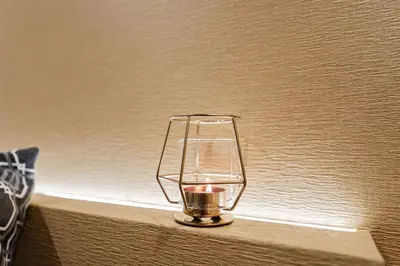 a candle holder sitting on top of a wall at Shinjuku SAIEI Hotel 201 in Tokyo