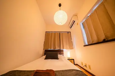 a small bedroom with a bed and a window at #36 -\u5e02\u8c37\u52a0\u8cc0\u753a- Entire House in Tokyo