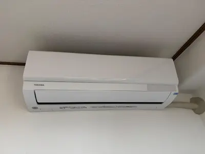 a white video game system hanging from a ceiling at Tokyo Stay Ikebukuro East in Tokyo