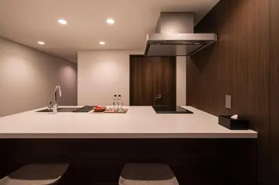 a kitchen with a sink and a stove at Cava House in Tokyo