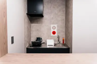 a kitchen with a sink and a stove at Visionary Stay HINODE in Tokyo