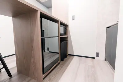 an empty room with a glass door in a building at Visionary Stay HINODE in Tokyo