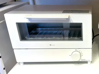 a white toaster oven sitting on a counter at Latte Sakura View Oshiage, 10min walk to Tokyo Skytree, walk to Asakusa in Tokyo